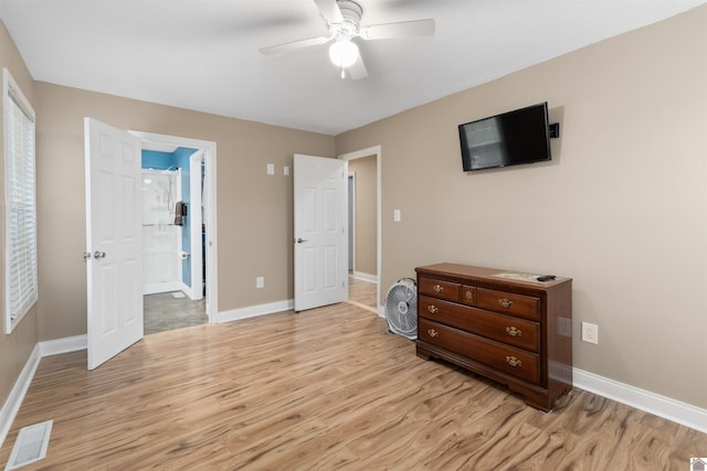 99 Jacey Blake Dr, Calvert City, KY 42029 - bedroom with light wood-type flooring, baseboards, and ensuite bath