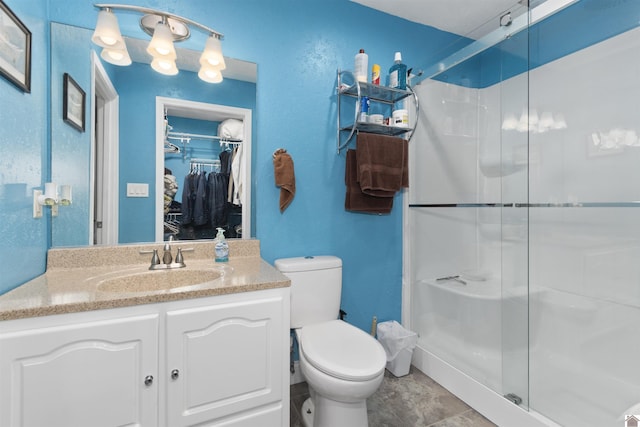 99 Jacey Blake Dr, Calvert City, KY 42029 - full bath with toilet, a stall shower, a walk in closet, and vanity