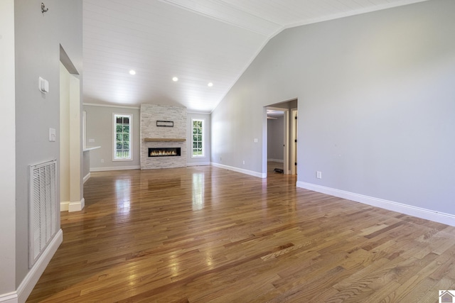 54 Grove Ln, Murray, KY 42071 - unfurnished living room featuring vaulted ceiling, light wood-style floors, a fireplace, and baseboards