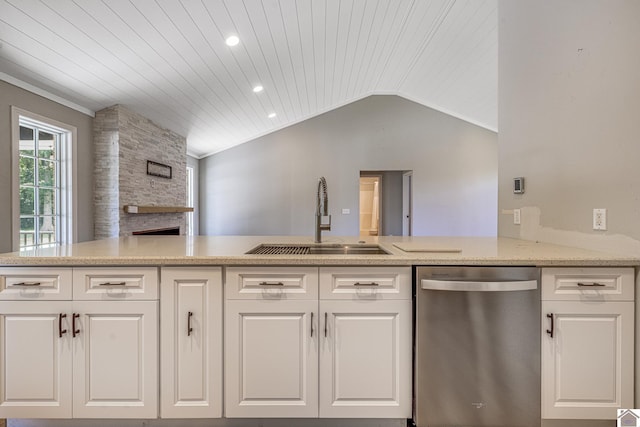 54 Grove Ln, Murray, KY 42071 - kitchen with dishwasher, a sink, a fireplace, white cabinets, and vaulted ceiling