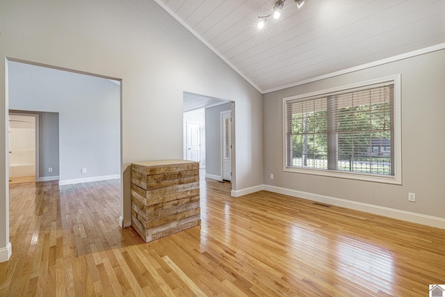 54 Grove Ln, Murray, KY 42071 - empty room featuring light wood finished floors, baseboards, high vaulted ceiling, and track lighting