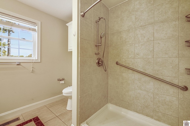 54 Grove Ln, Murray, KY 42071 - full bath with toilet, tile patterned floors, a tile shower, and baseboards