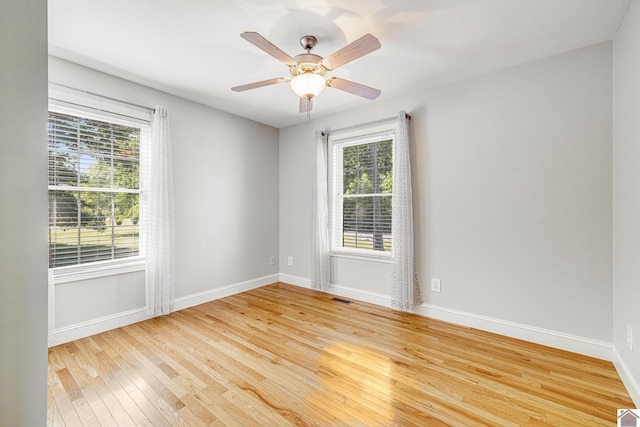 54 Grove Ln, Murray, KY 42071 - empty room featuring plenty of natural light, light wood-style flooring, and baseboards