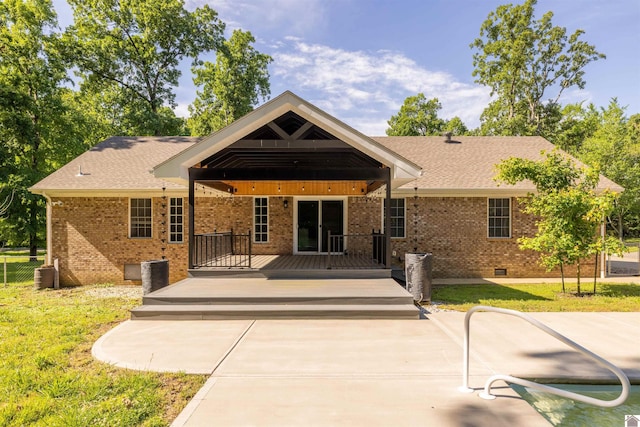 54 Grove Ln, Murray, KY 42071 - back of property featuring crawl space, brick siding, a deck, and roof with shingles