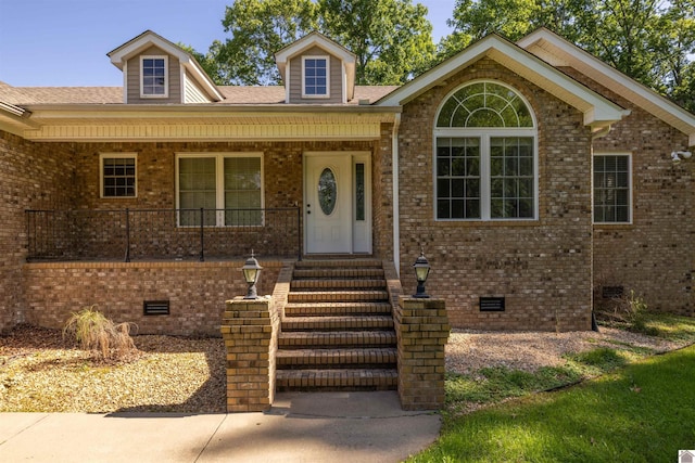 54 Grove Ln, Murray, KY 42071 - view of front of home featuring crawl space, brick siding, a porch, and a shingled roof