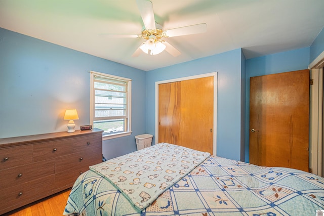 650 Cypress Cir, Calvert City, KY 42029 - bedroom with a closet, light wood-style flooring, and ceiling fan