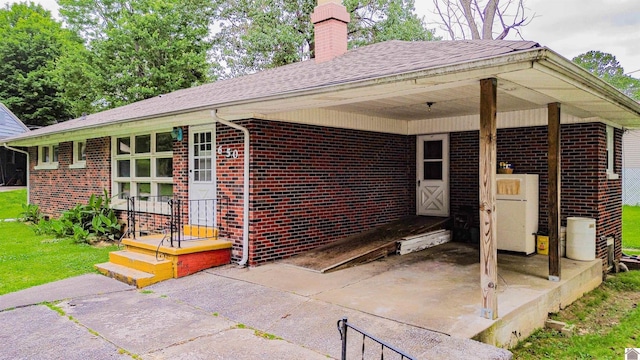 650 Cypress Cir, Calvert City, KY 42029 - view of patio with a carport and concrete driveway