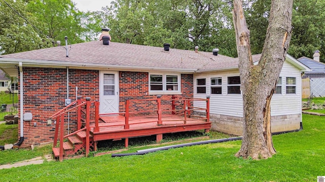 650 Cypress Cir, Calvert City, KY 42029 - back of property featuring a lawn, a chimney, a deck, roof with shingles, and brick siding