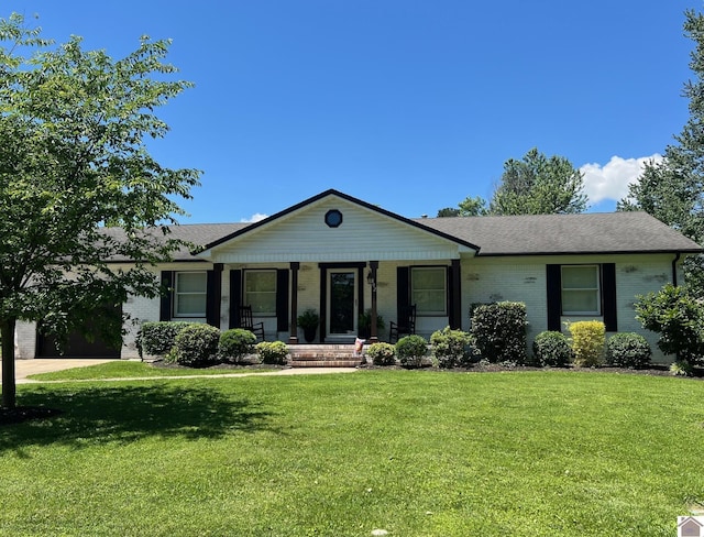 802 S 17th St, Murray, KY 42071 - single story home with covered porch, a front yard, brick siding, and a shingled roof