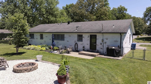 802 S 17th St, Murray, KY 42071 - back of property with an outdoor fire pit, a gate, a patio area, brick siding, and roof with shingles