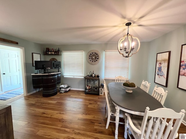 802 S 17th St, Murray, KY 42071 - dining area featuring a chandelier, dark wood-style flooring, and baseboards