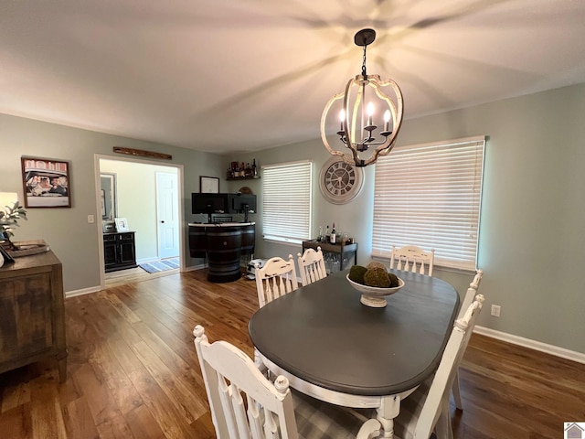 802 S 17th St, Murray, KY 42071 - dining room featuring a chandelier, wood finished floors, and baseboards