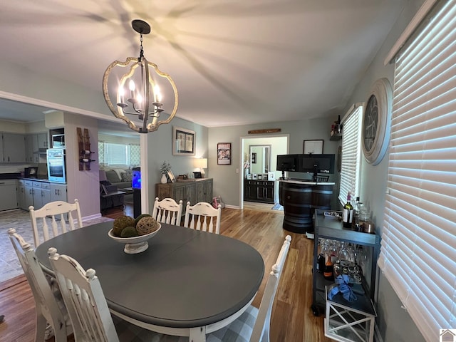 802 S 17th St, Murray, KY 42071 - dining room featuring a chandelier and wood finished floors