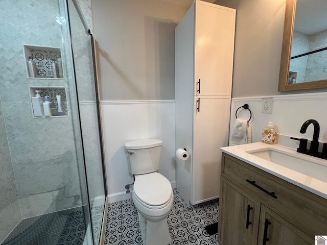 802 S 17th St, Murray, KY 42071 - full bathroom featuring vanity, wainscoting, toilet, a shower stall, and tile patterned floors