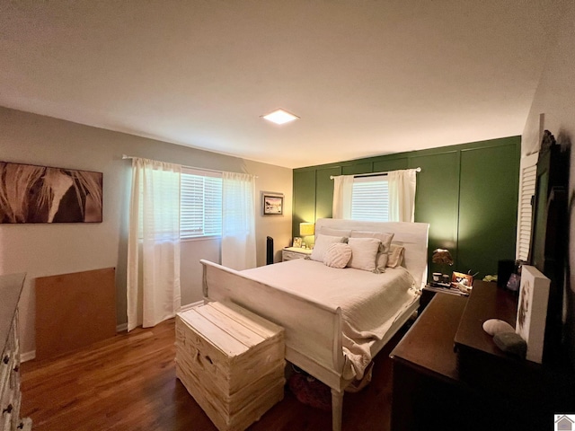 802 S 17th St, Murray, KY 42071 - bedroom with wood finished floors and multiple windows