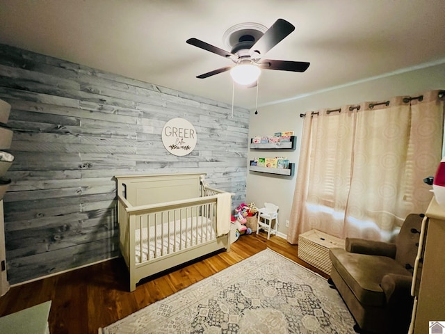 802 S 17th St, Murray, KY 42071 - bedroom with a nursery area, wood finished floors, ceiling fan, and baseboards