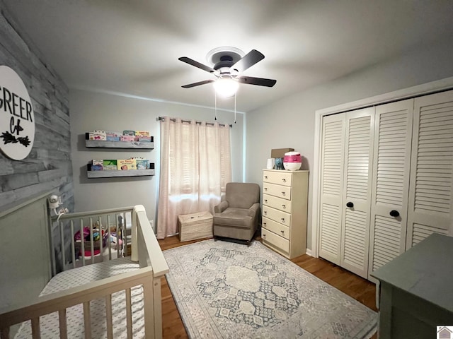 802 S 17th St, Murray, KY 42071 - bedroom featuring wood finished floors, a closet, ceiling fan, and a large fireplace
