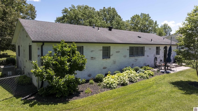 802 S 17th St, Murray, KY 42071 - back of property featuring a patio area, a shingled roof, brick siding, and central air condition unit