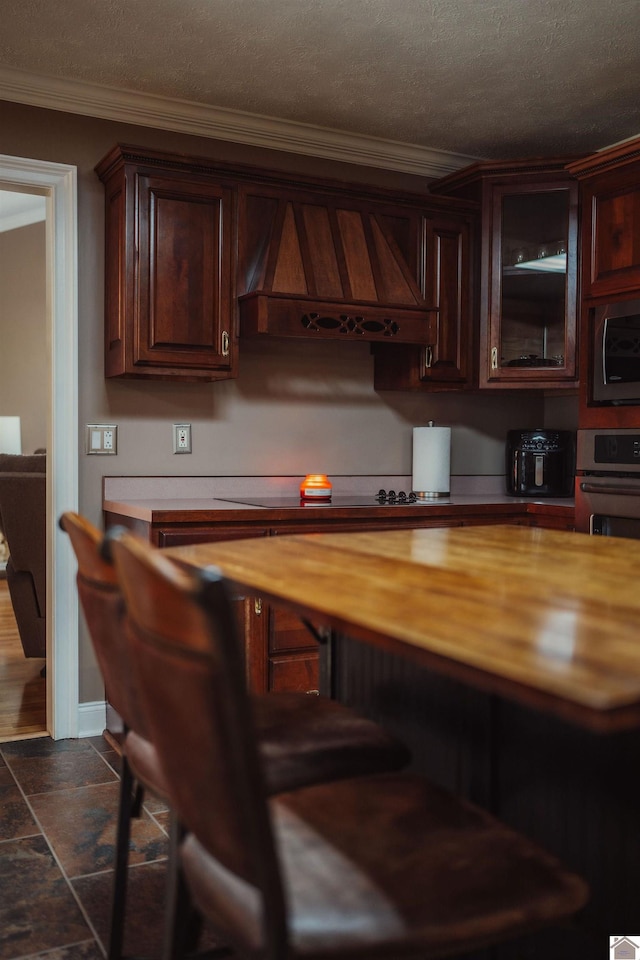 2878 State Route 303, Mayfield, KY 42066 - bar with custom exhaust hood, stainless steel appliances, ornamental molding, and a textured ceiling