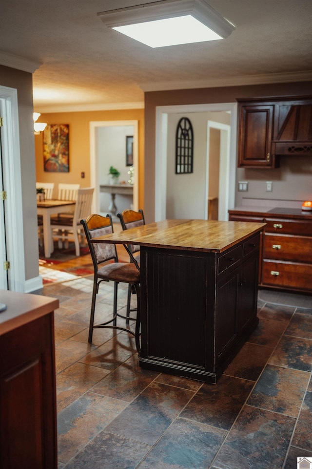 2878 State Route 303, Mayfield, KY 42066 - kitchen with ventilation hood, stone tile flooring, wooden counters, ornamental molding, and a kitchen island