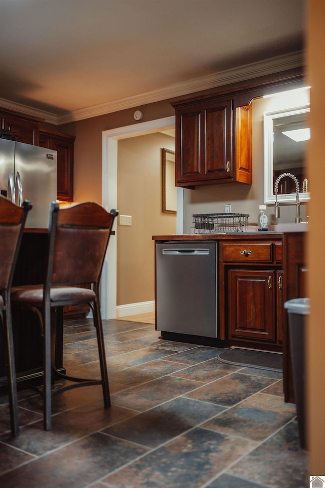 2878 State Route 303, Mayfield, KY 42066 - kitchen with appliances with stainless steel finishes, crown molding, baseboards, dark stone finish flooring, and a sink