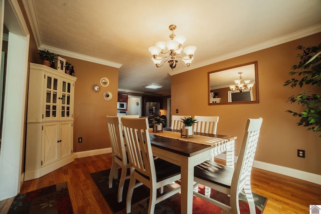 2878 State Route 303, Mayfield, KY 42066 - dining area featuring a chandelier, wood finished floors, ornamental molding, and baseboards