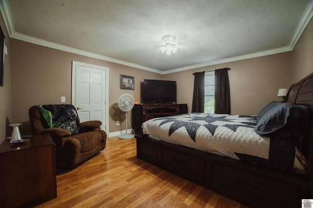 2878 State Route 303, Mayfield, KY 42066 - bedroom with light wood-style floors, crown molding, a textured ceiling, and baseboards