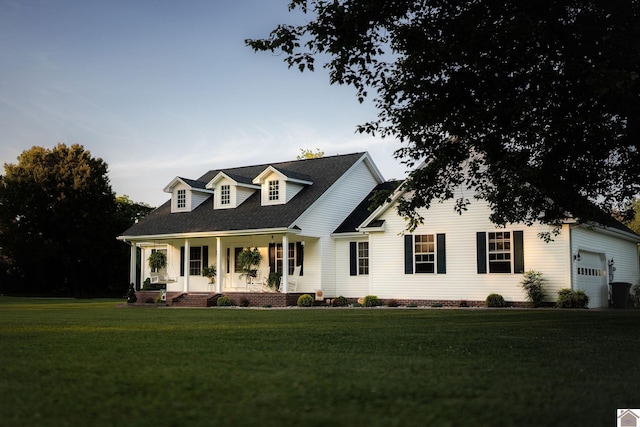 2878 State Route 303, Mayfield, KY 42066 - cape cod home featuring covered porch, a front yard, and an attached garage