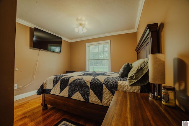2878 State Route 303, Mayfield, KY 42066 - bedroom with baseboards, ornamental molding, and wood finished floors