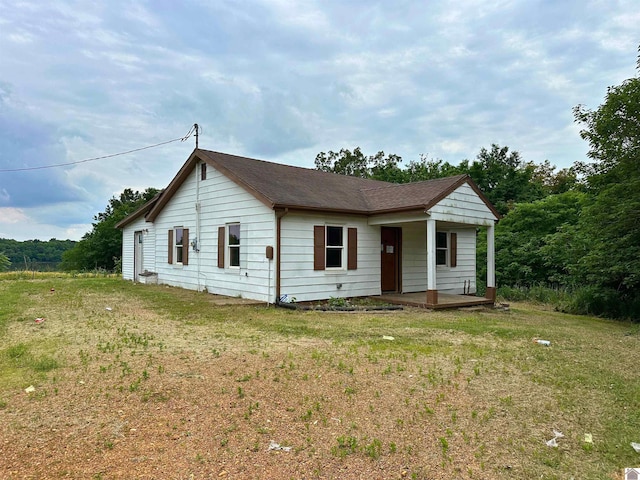 1251 Tater Rd, Mayfield, KY 42066 - single story home featuring a porch, a front lawn, and a shingled roof
