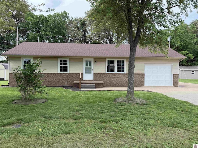 303 Union Cir, Mayfield, KY 42066 - single story home with brick siding, concrete driveway, a garage, a front lawn, and entry steps