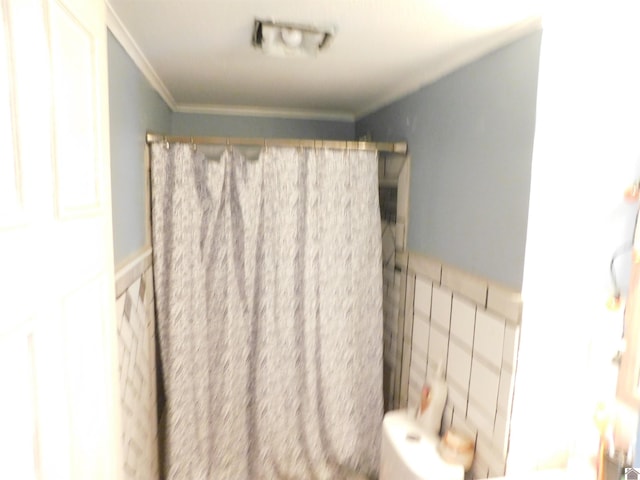 2837 Tennessee, Paducah, KY 42003 - bathroom featuring crown molding, a wainscoted wall, and curtained shower