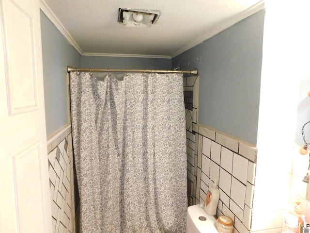 2837 Tennessee, Paducah, KY 42003 - full bath with tile walls, wainscoting, crown molding, and curtained shower