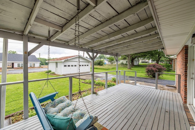 228 Country Dr, Marion, KY 42064 - wooden terrace with a garage, an outdoor structure, and a lawn