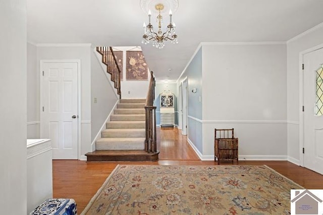 203 Golf Club Ln, Mayfield, KY 42066 - entrance foyer featuring wood finished floors, ornamental molding, stairway, a chandelier, and baseboards