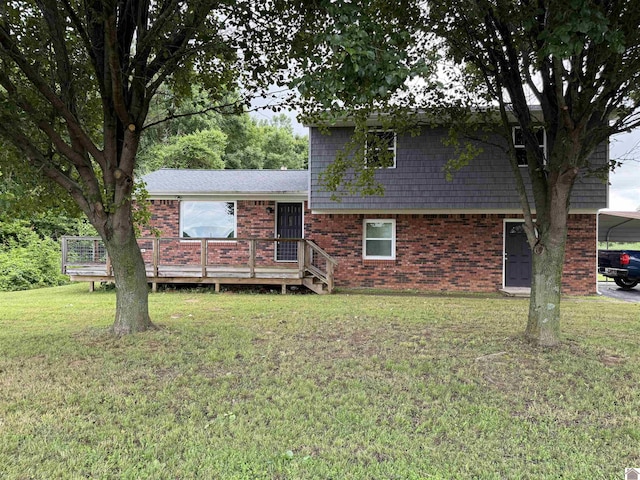 7740 Old Mayfield Rd, Paducah, KY 42003 - split level home with a deck, a front lawn, brick siding, and a detached carport