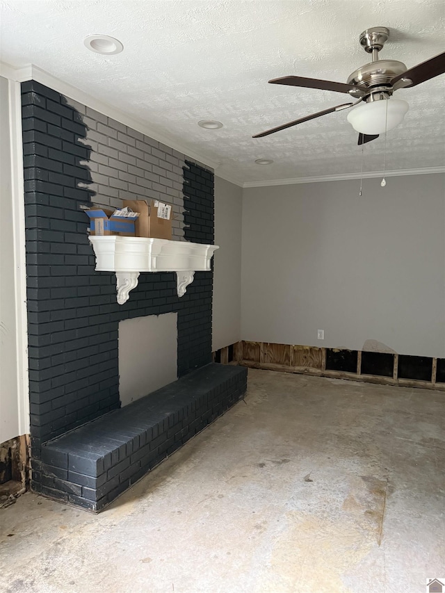 7740 Old Mayfield Rd, Paducah, KY 42003 - unfurnished living room featuring unfinished concrete floors, a ceiling fan, a textured ceiling, crown molding, and a brick fireplace