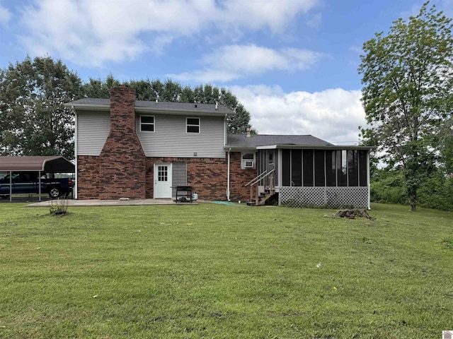 7740 Old Mayfield Rd, Paducah, KY 42003 - rear view of property featuring a sunroom, a yard, a carport, brick siding, and a chimney