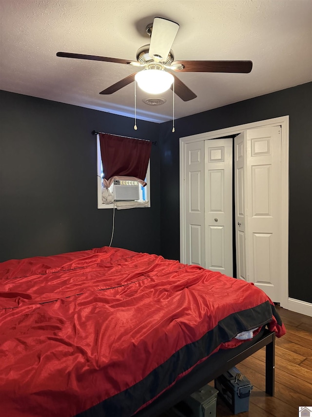 7740 Old Mayfield Rd, Paducah, KY 42003 - bedroom with wood finished floors, cooling unit, ceiling fan, and a closet