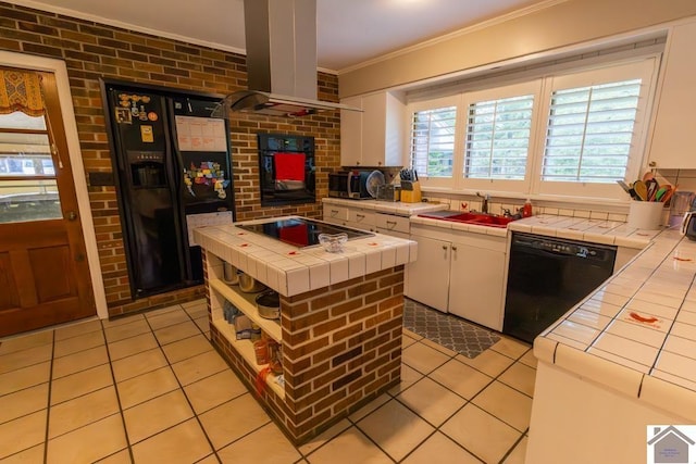 1218 Dogwood, Murray, KY 42071 - kitchen with tile counters, black appliances, island range hood, a sink, and crown molding