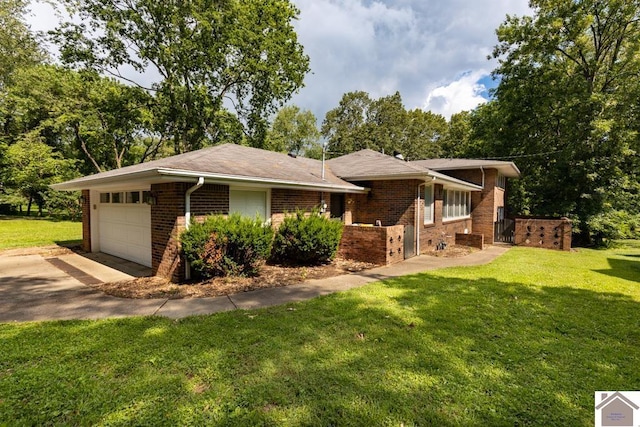 1218 Dogwood, Murray, KY 42071 - view of front of house with a garage, brick siding, a front yard, and driveway