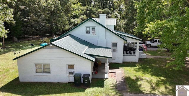 922 S 27th St, Paducah, KY 42003 - back of house featuring a yard, a chimney, and brick siding