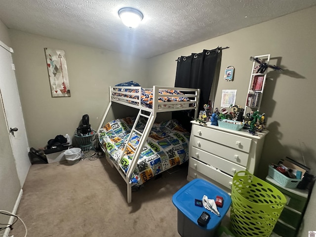 535 Leeds Dr, Paducah, KY 42003 - bedroom with carpet floors and a textured ceiling