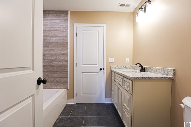 205 Clover Cres, Paducah, KY 42003 - bathroom with a tub, vanity, toilet, baseboards, and tile patterned flooring