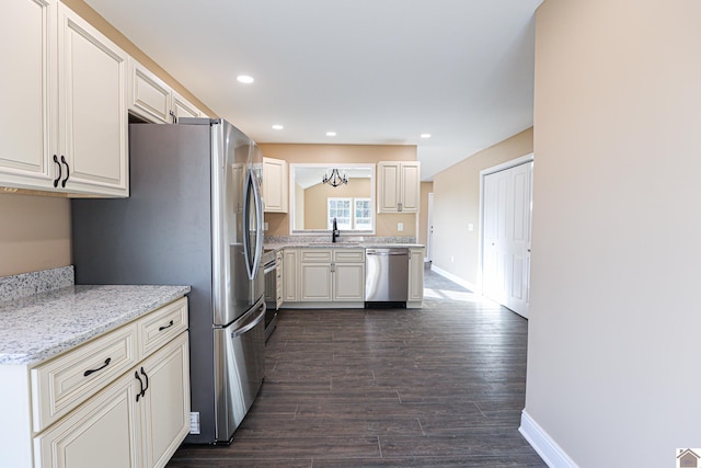 205 Clover Cres, Paducah, KY 42003 - kitchen with appliances with stainless steel finishes, a sink, baseboards, dark wood finished floors, and recessed lighting