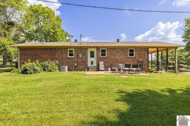 1667 Irvin Cobb Rd, Murray, KY 42071 - back of house with entry steps, central AC unit, a patio, and brick siding