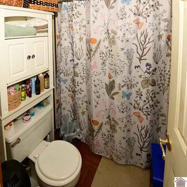 250 Jan Ann Dr, Paducah, KY 42003 - bathroom with toilet, a shower with curtain, and wood finished floors