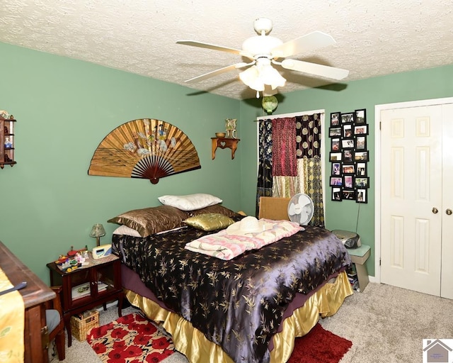 250 Jan Ann Dr, Paducah, KY 42003 - bedroom featuring carpet floors, a textured ceiling, and a ceiling fan