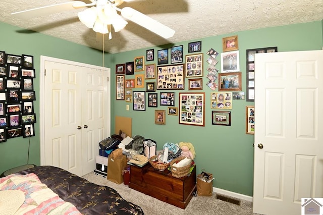 250 Jan Ann Dr, Paducah, KY 42003 - bedroom featuring carpet, a closet, a textured ceiling, baseboards, and a ceiling fan