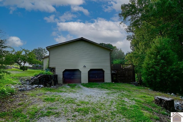 250 Jan Ann Dr, Paducah, KY 42003 - view of property exterior featuring a deck and an attached garage